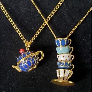 Duo of teapot and teacup necklaces.